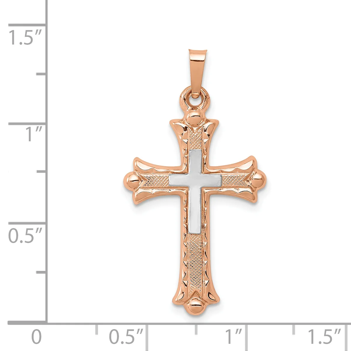 Rose gold cross pendant with textured surface and flared ends, shown next to a measurement scale indicating approximately one inch in width.