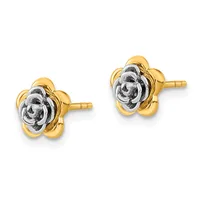 A pair of two-tone gold stud earrings featuring flower-shaped designs with textured centers and smooth petals, shown from the front against a white background.