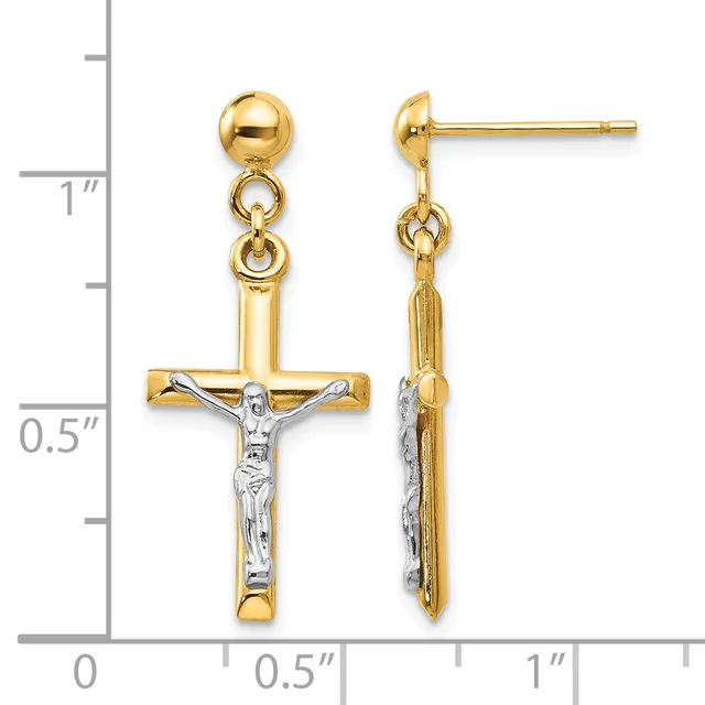 Two-tone gold crucifix earrings with white rhodium-plated corpus, dangling from ball posts with jump ring connectors, shown against a measurement scale.