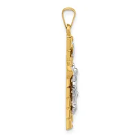 A two-tone gold pendant charm featuring a flute design with textured silver-colored details, suspended from a gold loop bail.