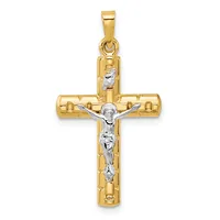 A two-tone gold crucifix pendant with a polished yellow gold cross and a white gold corpus figure, featuring a small loop bail at the top.