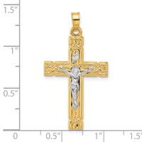 Two-tone gold crucifix pendant with textured borders and a silver-colored corpus, shown next to a measurement scale indicating approximately 1.25 inches in height.