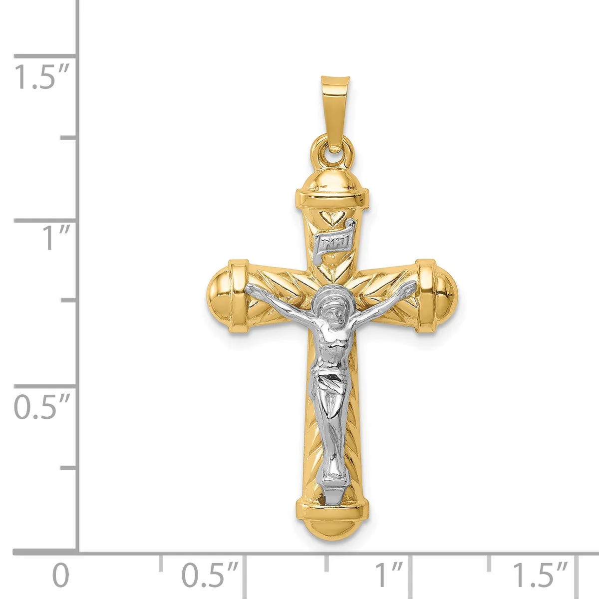 Two-tone gold crucifix pendant with white gold corpus figure, featuring rounded shouldered cross design with small hallmark, shown next to measurement scale.