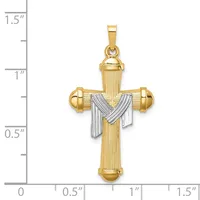 A gold cross pendant with vertical ribbed detailing and white gold draped fabric design across the center, shown against a measurement scale.