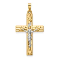 A two-tone gold crucifix pendant with a textured gold cross and a silver-toned corpus figure, featuring decorative linear patterns along the vertical and horizontal arms.