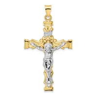 Two-tone gold and silver crucifix pendant with ornate leaf details at the top and INRI inscription, featuring a detailed corpus figure.