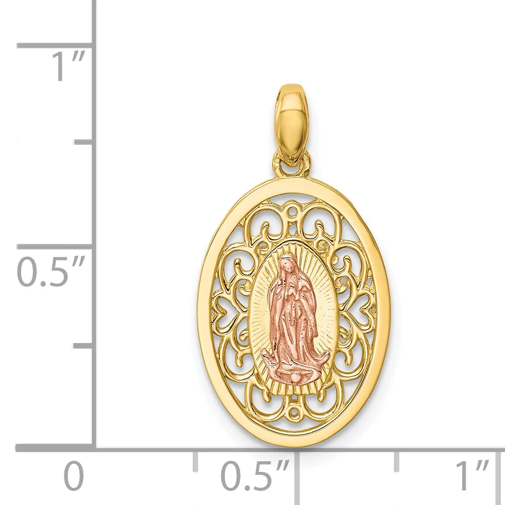 A two-tone gold oval pendant featuring an ornate filigree border in yellow gold surrounding a central religious figure in rose gold, with a small stamped hallmark, shown against a measurement scale.