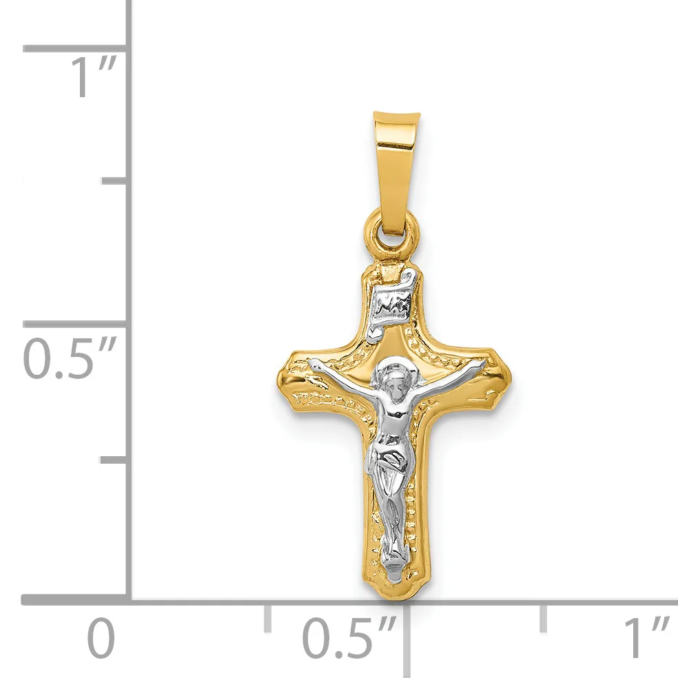 Two-tone gold crucifix pendant with white gold corpus, shown next to a ruler indicating approximately 0.75 inches in height.