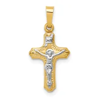 A two-tone gold crucifix pendant with a polished yellow gold cross and a white gold corpus figure, suspended from a matching bail.