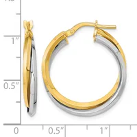 Two-tone gold and silver hoop earrings with a twisted design, displayed next to a measurement scale showing approximately one inch in diameter.