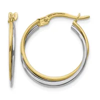 A pair of two-tone hoop earrings with yellow gold outer edges and white gold inner surfaces, shown from the front and side views with a hinged post closure.