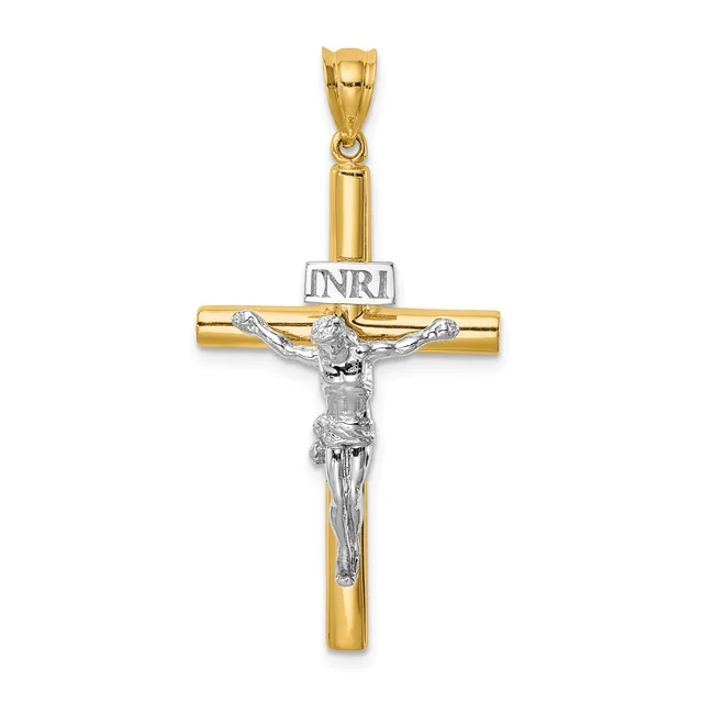 Two-tone gold and silver crucifix pendant with a hollow tubular gold cross and a detailed silver corpus, suspended from a gold bail.