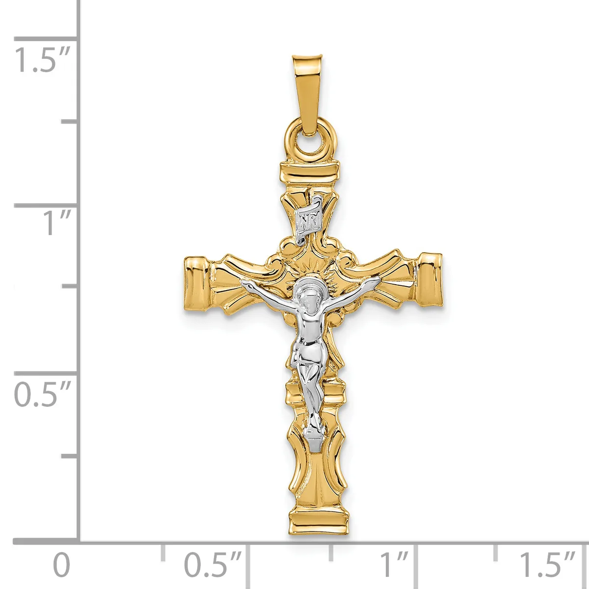 Two-tone gold crucifix pendant with textured gold cross arms and a white gold corpus figure, shown against a measurement scale indicating approximately 1.25 inches in height.
