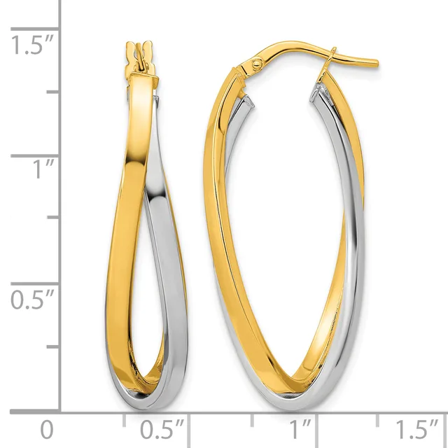 Two-tone oval hoop earrings in yellow and white gold with a polished finish, shown next to a measurement scale indicating approximately one inch in length.