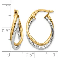 Two-tone oval hoop earrings with intertwined yellow and white gold bands, shown next to a ruler indicating approximately one inch in length.