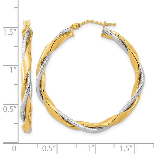 Two-tone twisted hoop earrings with yellow and white gold coloring, measuring 1.5 inches in length, shown with a measurement scale.