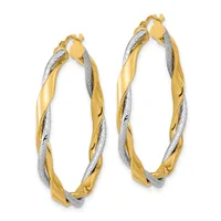 Pair of twisted two-tone gold and silver hoop earrings with hinged closures, displayed against a white background.
