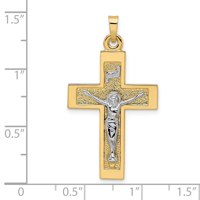 Gold crucifix pendant with textured gold cross and silver-toned corpus figure, shown against a ruler measuring approximately 1.25 inches tall.
