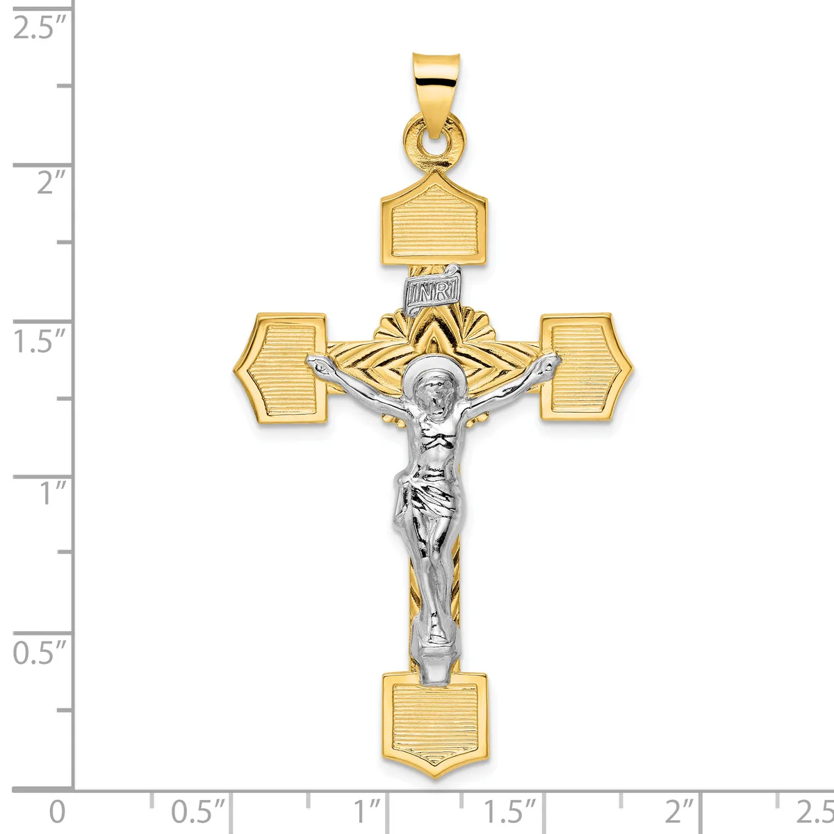 Two-tone gold and silver crucifix pendant with textured gold cross arms and a polished silver corpus, displayed against a measurement ruler showing approximately 2.5 inches in length.