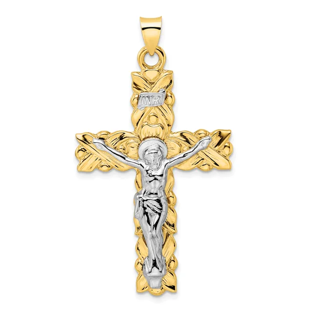 Two-tone gold crucifix pendant with ornate leafy design on the arms and a white gold corpus of Christ figure suspended from a bail.