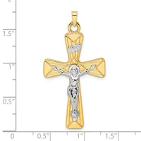 Two-tone gold cross pendant with a polished yellow gold cross and white gold crucifix figure, shown against a measurement scale indicating approximately 1.75 inches in height.