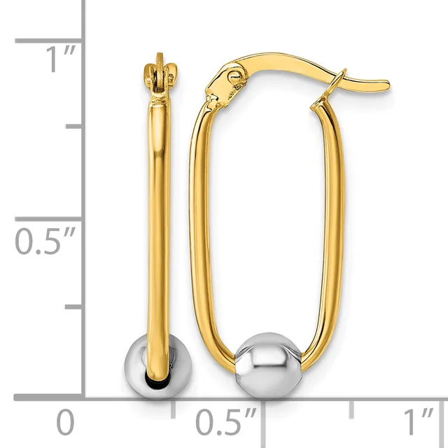 Gold-toned hollow oval hoop earrings with polished silver-toned spherical accents at the bottom, shown next to a measurement scale.