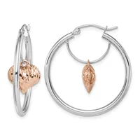 Pair of two-tone hoop earrings with silver outer hoops and rose gold leaf-shaped charms hanging from inner silver loops.