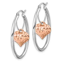 Pair of two-tone hoop earrings with silver outer hoops and rose gold textured heart charms hanging from small connectors.