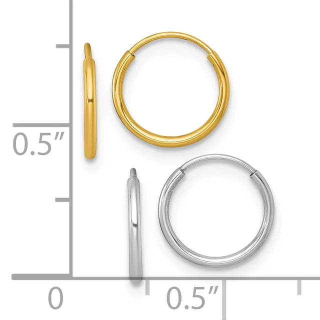 Two pairs of polished metal hoop earrings with hinged closures, one gold-toned and one silver-toned, displayed next to a ruler showing approximately 0.5 inch diameter.