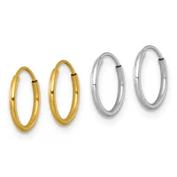 Two pairs of polished hoop earrings displayed side by side, with smaller gold hoops on the left and larger silver hoops on the right.