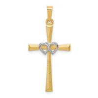 Gold cross pendant with textured vertical bar and two interlocked hearts in white metal at the center, featuring a bailed loop at top for chain attachment.
