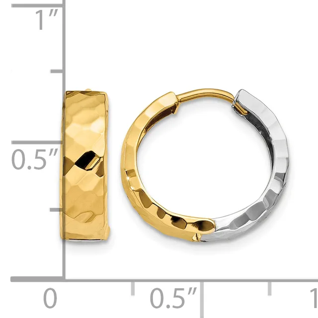 A pair of two-tone gold hoop earrings with a textured hammered finish and hinged closure, shown with a measurement scale indicating approximately one inch in height.