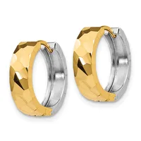 A pair of two-tone gold and silver hoop earrings with a faceted, textured surface and hinged closure.