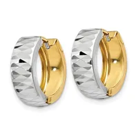 A pair of two-tone hoop earrings featuring polished gold inner surfaces and white metal outer surfaces with a diamond-cut textured pattern.