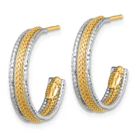 Pair of two-tone hoop earrings with textured yellow gold centers bordered by white textured metal and gold posts with small oval clasps.