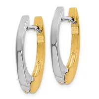 A pair of two-tone hoop earrings with white metal outer curves and gold inner surfaces, displayed side by side with a small hallmark visible on the gold interior.