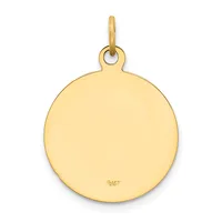 A polished gold circular pendant with a loop attachment at the top and a small stamped hallmark on the lower surface.