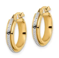 A pair of two-tone gold hoop earrings with textured white gold sections on the outer edges and polished yellow gold bodies, shown from a front angle.