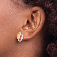 A person wearing a gold and pink enamel stud earring shaped like a leaf or feather, shown in profile view.