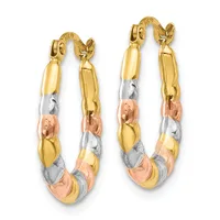 A pair of tricolor gold hoop earrings with segmented bands in yellow, white, and rose gold, featuring a curved hook closure.