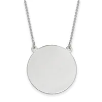A polished silver circular pendant hangs from a delicate twisted silver chain against a white background.