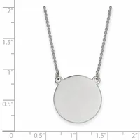 Silver circular pendant on a thin chain necklace, shown against a ruler measuring approximately 2 inches in length.