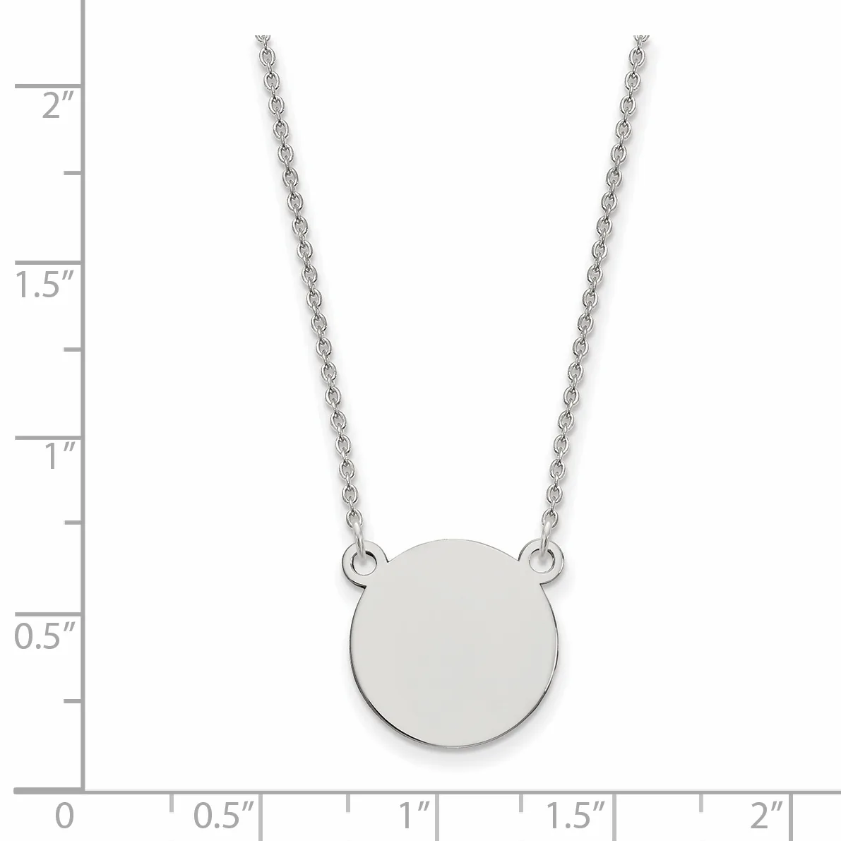 Silver chain necklace with a small circular disc pendant, shown against a ruler measuring approximately 2 inches in length.