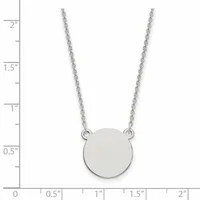 Silver chain necklace with a small circular disc pendant, shown against a ruler measuring approximately 2 inches in length.