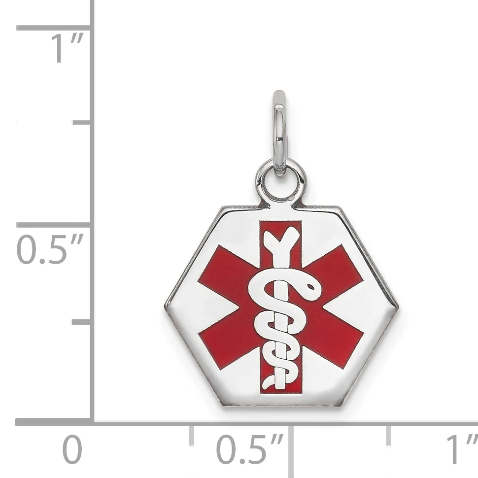 A hexagonal medical alert pendant in silver-tone metal with a red and white enamel star of life symbol, shown next to a ruler indicating its size as approximately half an inch wide.