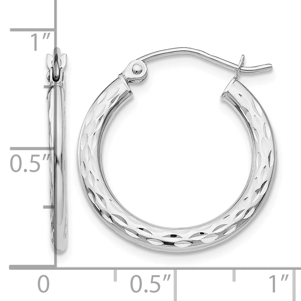 Silver-tone textured hoop earrings with a diameter of approximately one inch, shown with measurement scale and close-up detail of the surface pattern.