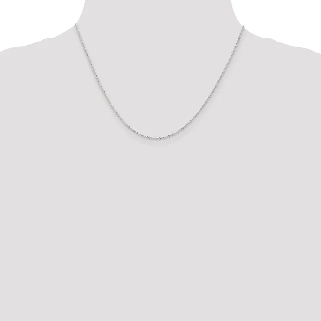 A thin silver chain necklace displayed on a mannequin torso against a white background.
