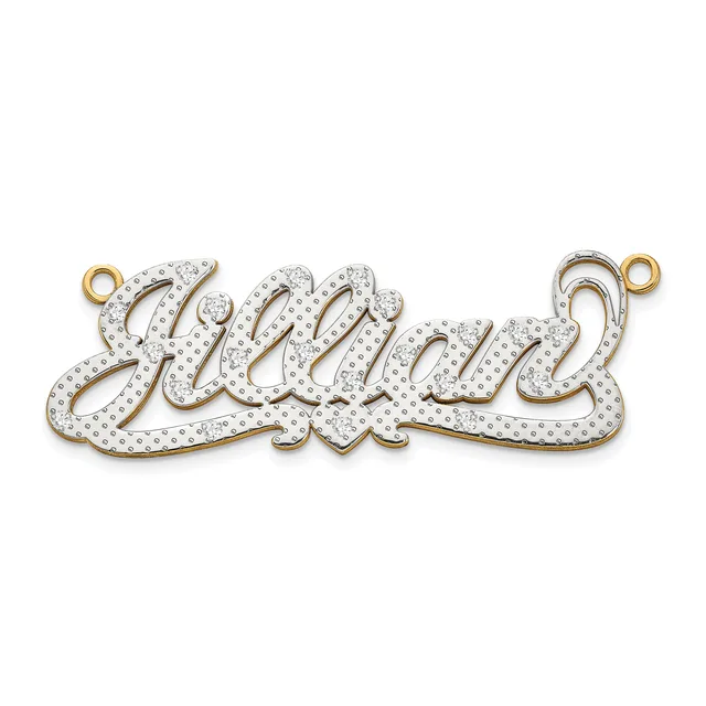 Two-tone nameplate pendant with script lettering, white rhinestone paving, and small gold-toned loops on each end, displayed against a white background.