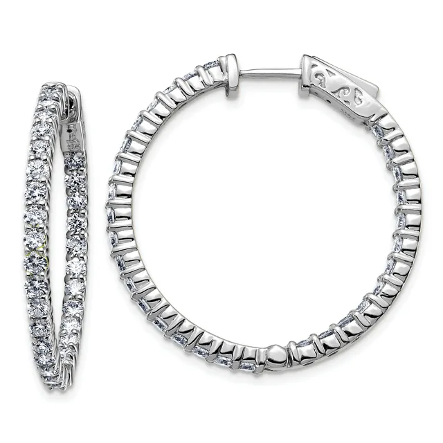 Pair of silver hoop earrings with round diamond settings along the outer and inner edges, shown from the front and side view.