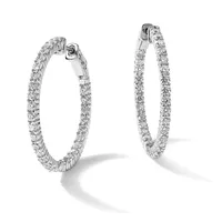 A pair of diamond hoop earrings set in white metal, displayed at different angles to show the front and side views with sparkling round diamonds covering the entire surface.